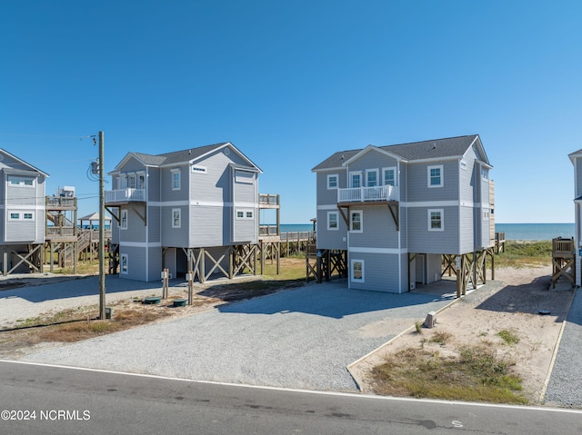 exterior space featuring a water view and a carport