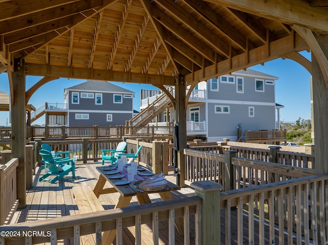 wooden terrace featuring a gazebo