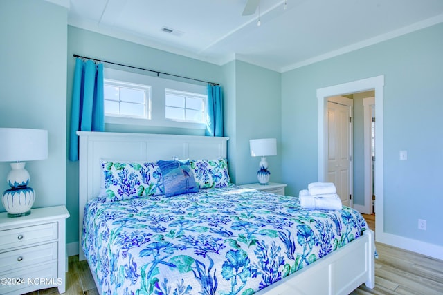 bedroom with ceiling fan and light hardwood / wood-style flooring