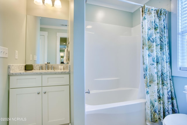 1016 New River Inlet Rd, North Topsail Beach, NC 28460 - bathroom featuring vanity, shower / bath combination with curtain, visible vents, and toilet