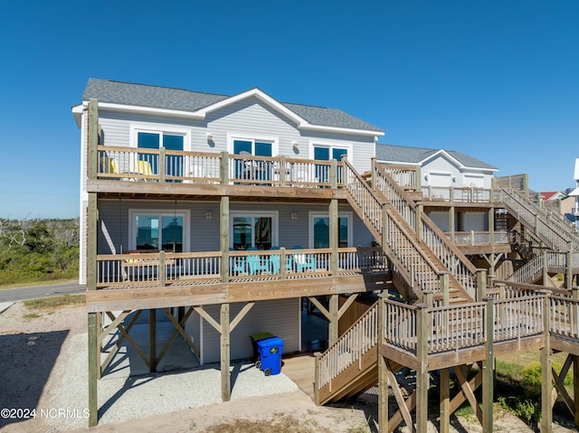 1016 New River Inlet Rd, North Topsail Beach, NC 28460 - rear view of property with stairway, a wooden deck, and a shingled roof