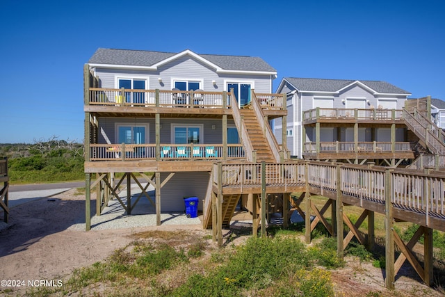 rear view of house with a wooden deck