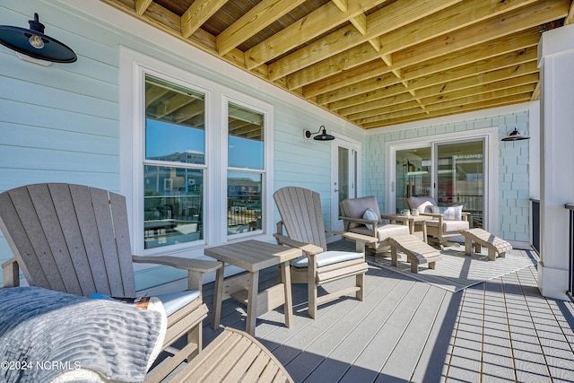 wooden deck with an outdoor hangout area