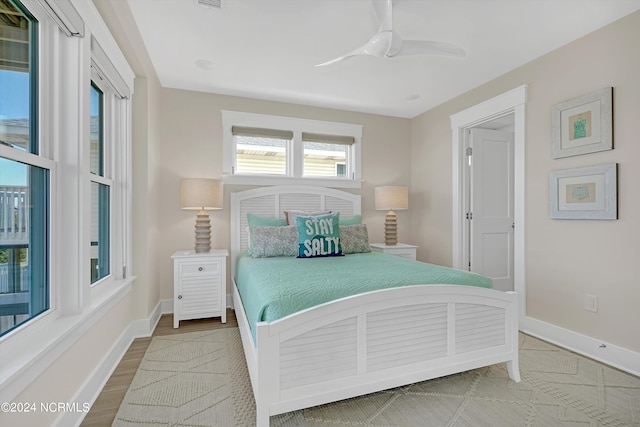 bedroom featuring wood-type flooring and ceiling fan