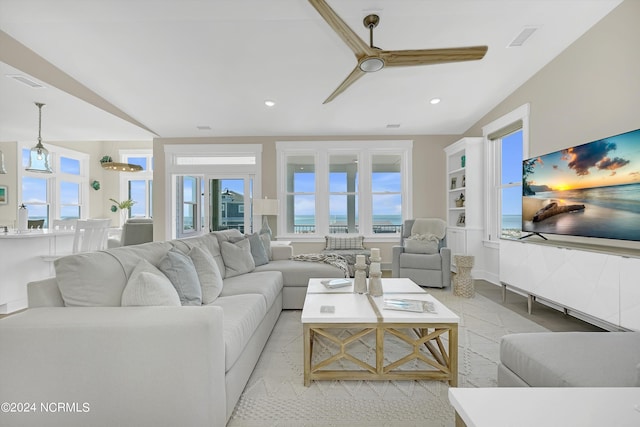 living room featuring ceiling fan, a healthy amount of sunlight, and light tile patterned flooring