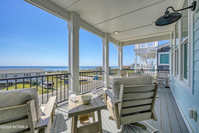 balcony featuring a water view