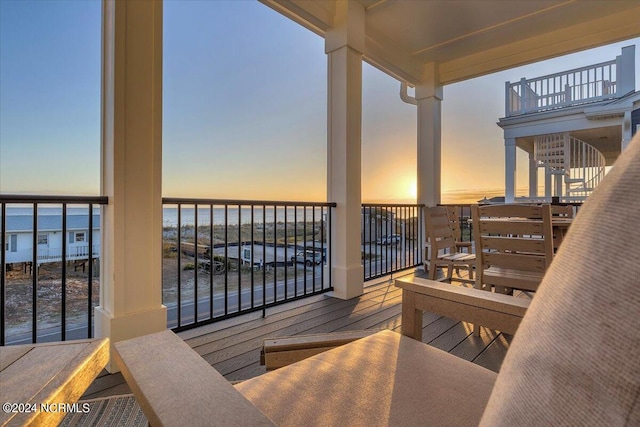 balcony at dusk with a water view