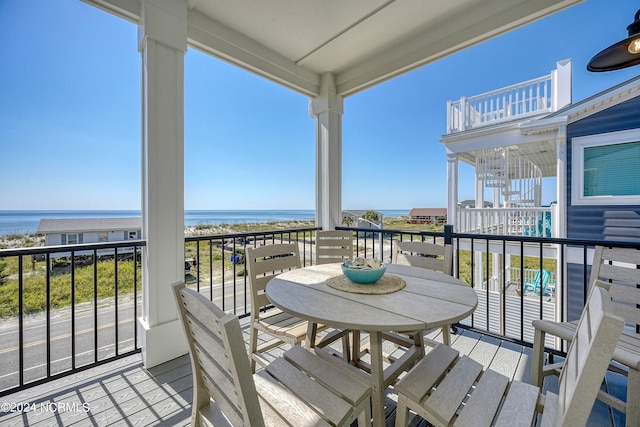 balcony featuring a water view