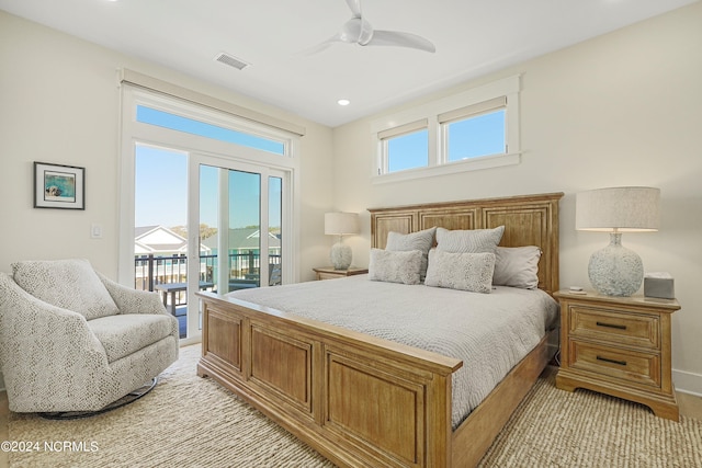 bedroom with access to exterior, multiple windows, and ceiling fan