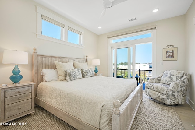 bedroom with ceiling fan, multiple windows, access to outside, and hardwood / wood-style flooring