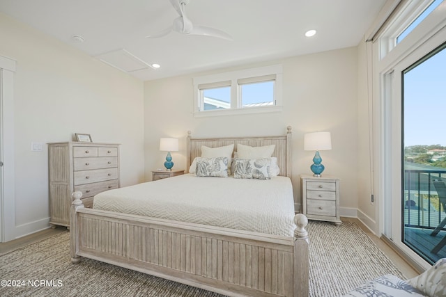 bedroom featuring access to exterior, light hardwood / wood-style floors, and ceiling fan