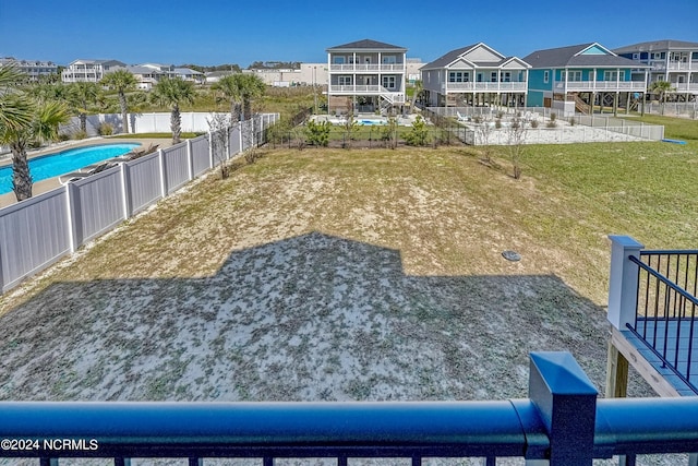 view of yard with a fenced in pool