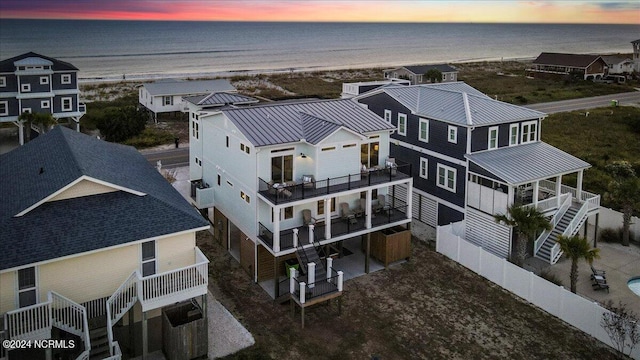 aerial view at dusk with a water view