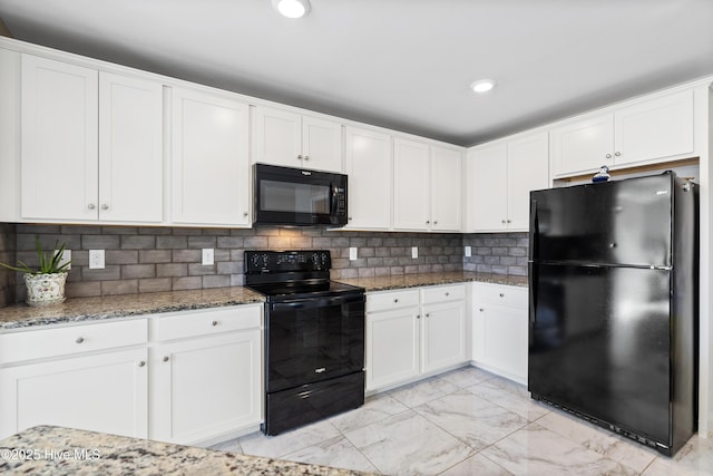 kitchen with white cabinets, marble finish floor, black appliances, tasteful backsplash, and dark stone countertops