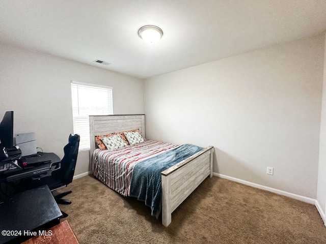 bedroom featuring dark colored carpet