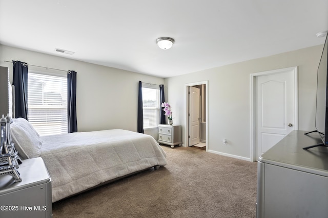 bedroom featuring baseboards, visible vents, and light colored carpet