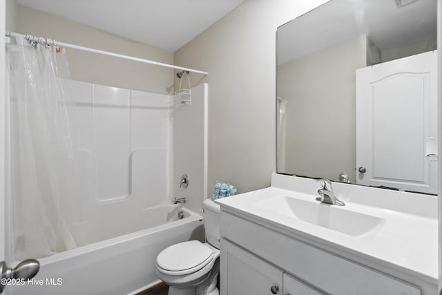 bathroom with shower / bath combination with curtain, vanity, and toilet