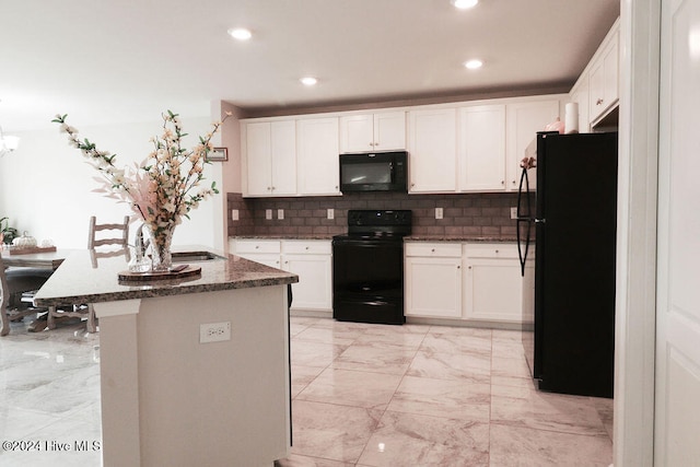 kitchen with white cabinetry, black appliances, a center island, and decorative backsplash