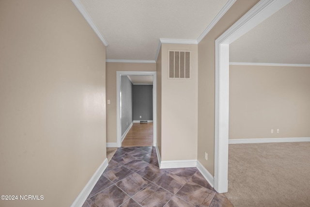 hall with crown molding and carpet