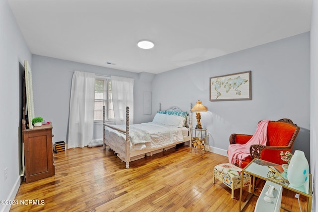 bedroom with hardwood / wood-style flooring