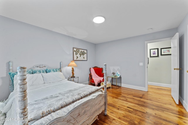 bedroom with hardwood / wood-style flooring