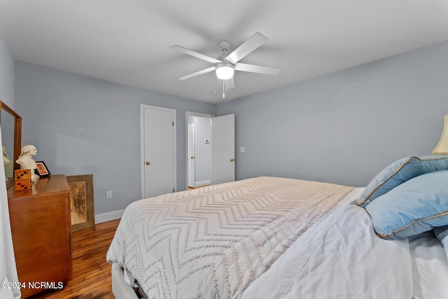 bedroom with hardwood / wood-style flooring and ceiling fan