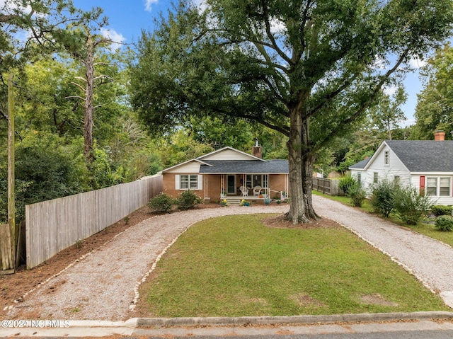 view of front of home featuring a porch and a front lawn