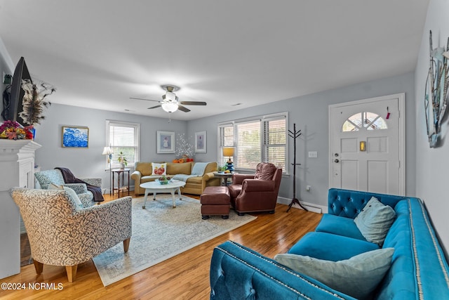 living room featuring hardwood / wood-style flooring and ceiling fan