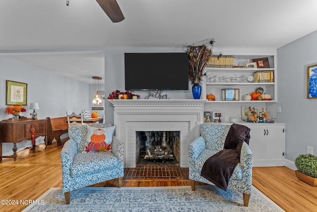 living area featuring a fireplace and hardwood / wood-style flooring