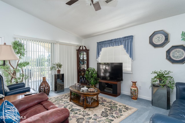 living room featuring ceiling fan, vaulted ceiling, and carpet