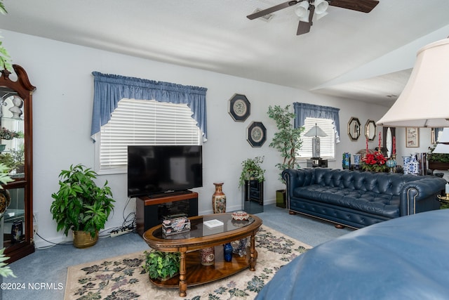 living room featuring carpet and ceiling fan