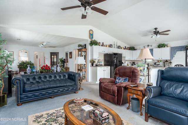 living room featuring light carpet, vaulted ceiling, and ceiling fan