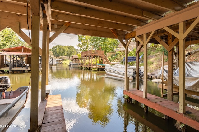 dock area featuring a water view