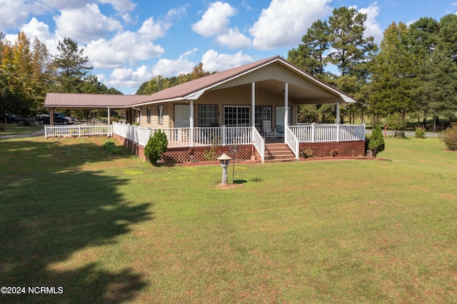 farmhouse inspired home featuring a front lawn and covered porch