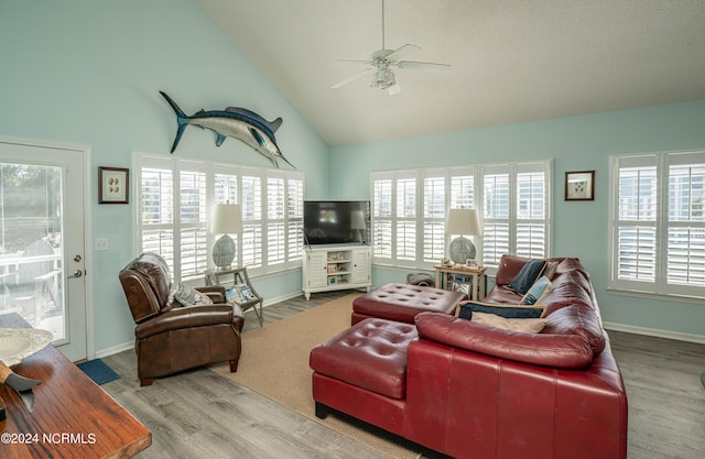 living room with high vaulted ceiling, wood-type flooring, and ceiling fan