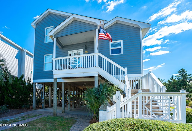 coastal inspired home featuring a carport