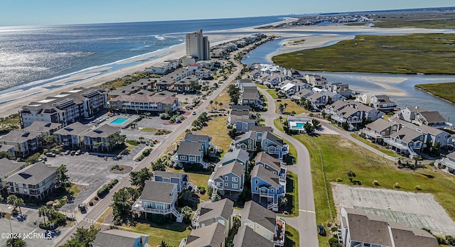 birds eye view of property featuring a view of the beach and a water view