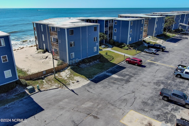 bird's eye view featuring a beach view and a water view