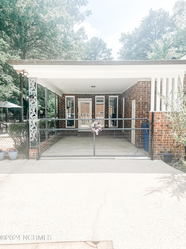 view of gate with a carport