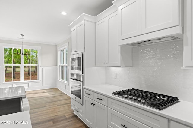 233 Hampton Ct, Hampstead, NC 28443 - carpeted empty room with baseboards, a ceiling fan, visible vents, and ornamental molding