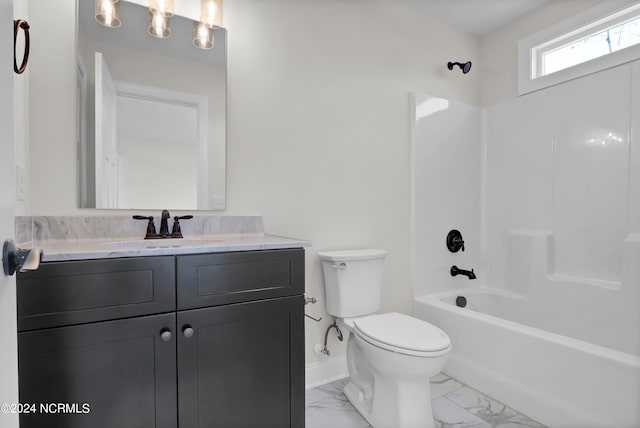 full bath featuring vanity, baseboards, shower / bathing tub combination, toilet, and marble finish floor