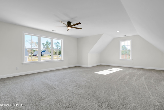 bonus room featuring lofted ceiling, carpet, and ceiling fan