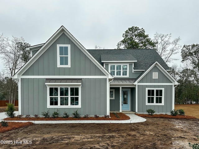 modern inspired farmhouse with metal roof, board and batten siding, and a standing seam roof