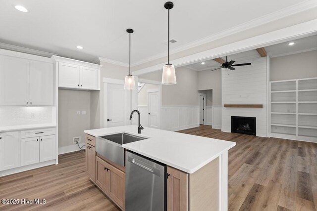 233 Hampton Ct, Hampstead, NC 28443 - kitchen with light stone countertops, stainless steel appliances, decorative backsplash, and white cabinetry