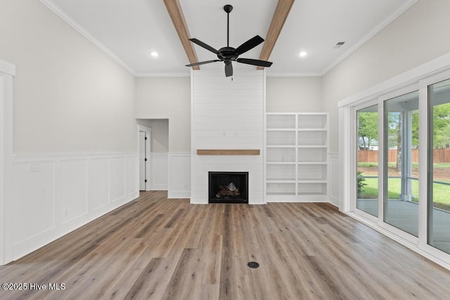 233 Hampton Ct, Hampstead, NC 28443 - unfurnished dining area featuring plenty of natural light, a decorative wall, a wainscoted wall, and ornamental molding
