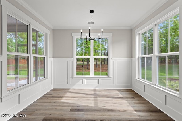 233 Hampton Ct, Hampstead, NC 28443 - unfurnished bedroom with a barn door, light colored carpet, baseboards, ornamental molding, and visible vents