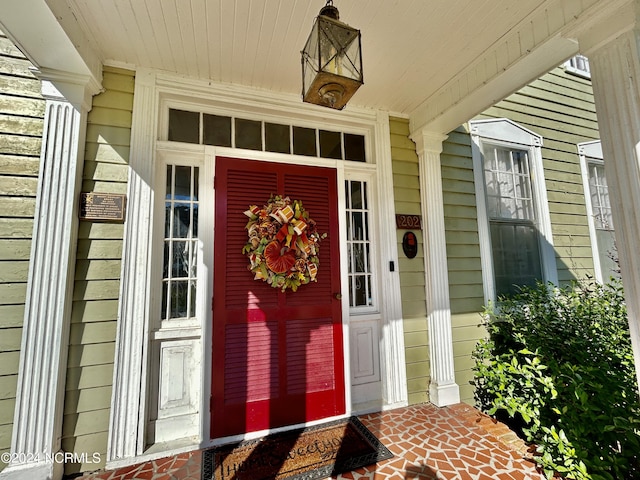 202 S Main St, Colerain, NC 27924 - doorway to property featuring covered porch