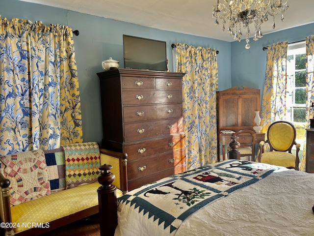 bedroom featuring a notable chandelier