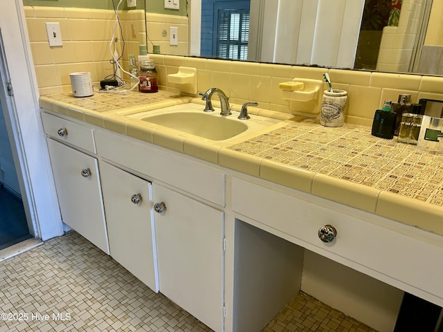 bathroom featuring backsplash, vanity, and tile patterned floors