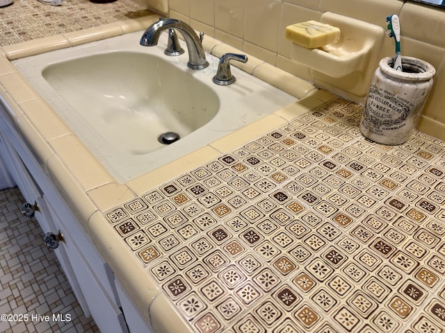 bathroom featuring tile patterned flooring and a sink